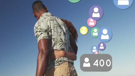 Animation-of-social-media-people-digital-icons-over-couple-on-beach