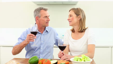 Mature-couple-drinking-red-wine-together