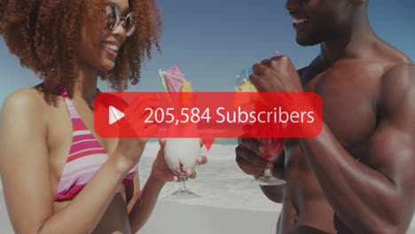 Animation-of-speech-bubble-with-subscribers-numbers-over-couple-having-drinks-on-beach