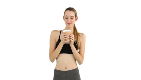 Fit-model-drinking-from-disposable-cup