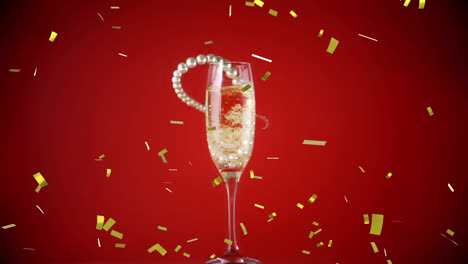 Animation-of-gold-confetti-with-pearl-necklace-falling-into-champagne-glass-on-red-background