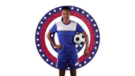 Portrait-of-african-american-female-soccer-player-holding-a-ball-against-stars-on-spinning-circles