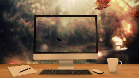 Desktop-Computer-Und-Bürogeräte-Auf-Einem-Tisch-Vor-Herbstlichen-Ahornblättern,-Die-Im-Hintergrund-Fallen