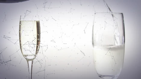 Animation-of-network-of-connections-over-champagne-glasses-on-white-background