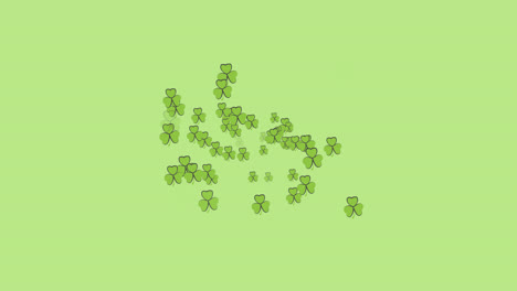 Digital-animation-of-multiple-clover-leaves-forming-against-green-background