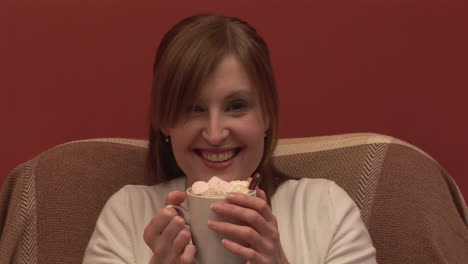 Stock-Footage-of-a-woman-on-a-couch-Drinking-Coffee