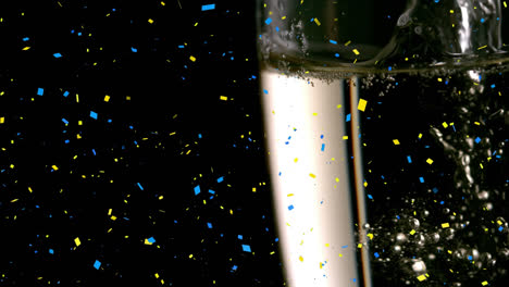Animation-of-confetti-falling-over-champagne-pouring-into-three-glass-on-black-background