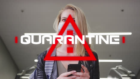 Animation-of-text-quarantine,-over-triangle,-with-woman-in-face-mask-using-smartphone-in-city