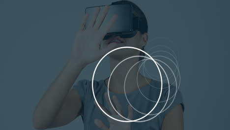 Animation-of-scopes-scanning-over-businesswoman-wearing-vr-headset