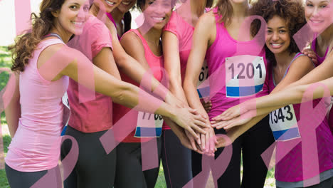 Animation-of-multiple-pink-ribbon-logo-over-diverse-group-of-smiling-women
