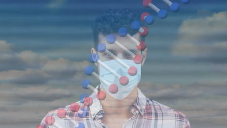 Animation-of-dna-strand-spinning-over-man-wearing-face-mask