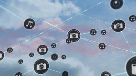 Network-of-digital-camera-icons-against-clouds-in-blue-sky
