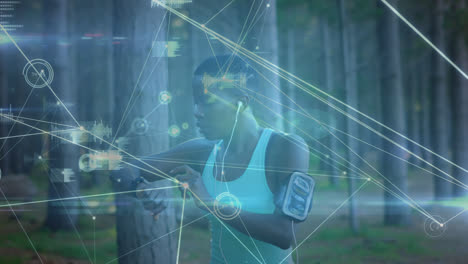 Animation-of-network-of-connections-over-woman-using-smartwatch-exercising-in-forest