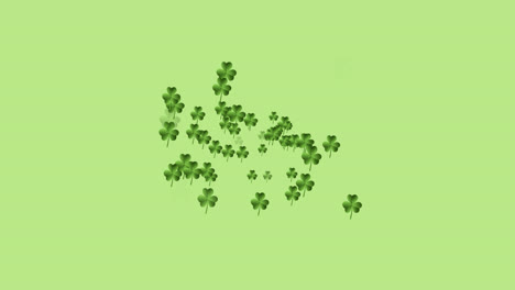 Digital-animation-of-multiple-clover-leaves-forming-against-green-background