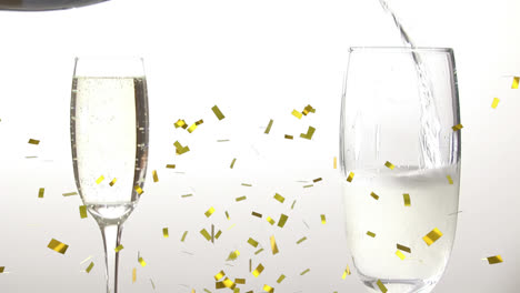 Animation-of-confetti-falling-over-champagne-glasses-on-white-background