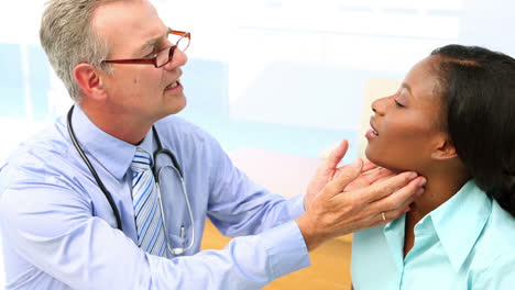 Doctor-checking-glands-of-his-patient