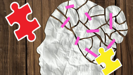 Animation-of-green,-red-and-yellow-puzzle-pieces-falling-over-human-head-with-taped-pieces