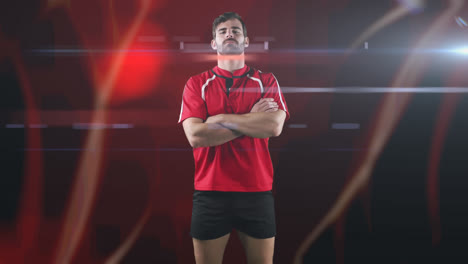 Animation-of-rugby-player-standing-with-arms-crossed-over-glowing-light-trails-on-red-background