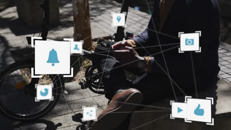 Network-of-digital-icons-against-mid-section-of-person-using-smartphone-on-the-street
