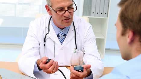 Doctor-taking-blood-pressure-of-his-patient