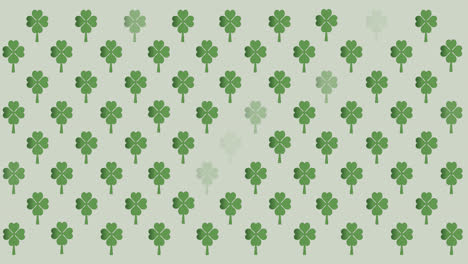 Digital-animation-of-multiple-clover-leaves-flickering-against-grey-background