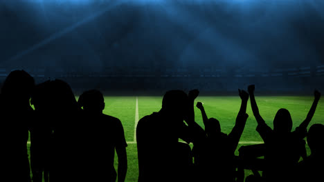 Animation-of-silhouettes-of-sports-fans-cheering-over-sports-stadium