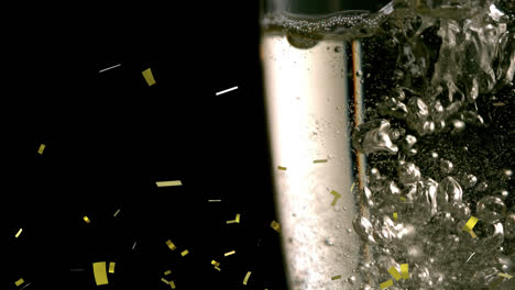 Animation-of-gold-confetti-falling-over-champagne-pouring-into-three-glasses-on-black-background