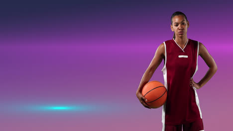 Animation-of-female-basketball-player-holding-ball-over-glowing-pink-background