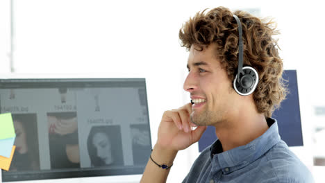 Content-creative-designer-phoning-with-headset-