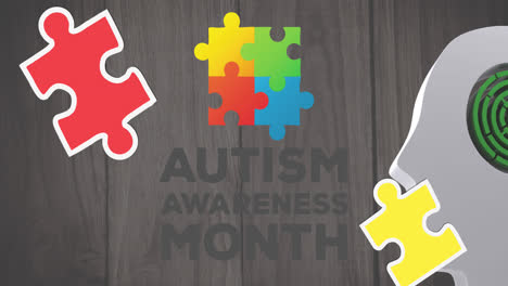 Animation-of-puzzles-falling-over-autism-awareness-month-text-and-human-brain-with-maze