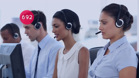 Animation-of-numbers-changing-over-business-people-wearing-phone-headsets