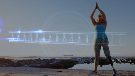 Animation-of-dna-strand-over-woman-with-artificial-limb-meditating-by-seaside