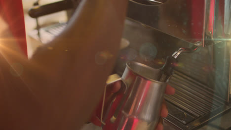 Animation-of-hands-of-barista-frothing-milk-using-machine-at-a-cafe