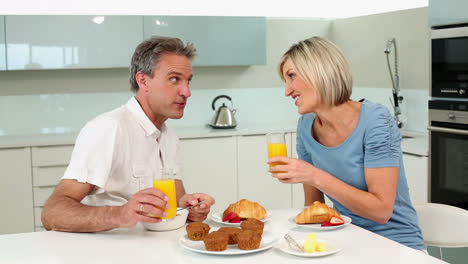 Mature-couple-having-a-romantic-breakfast-together