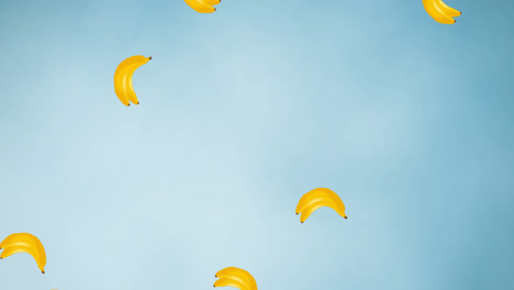 Animation-of-bananas-moving-on-blue-background