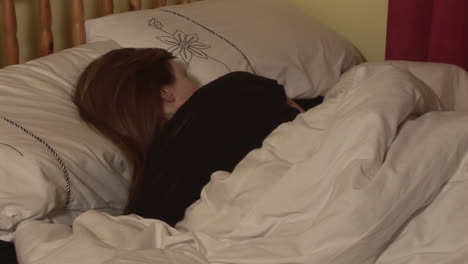 Stock-Footage-of-a-Woman-in-Bed