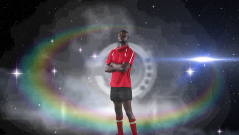 Animation-of-rugby-player-standing-with-arms-crossed-over-glowing-light-with-prism-in-background