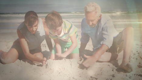Animation-of-glowing-light-over-happy-senior-man-with-his-daughter-and-grandson-by-seaside