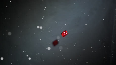 Animation-of-white-dots-floating-over-red-dice-falling-and-rolling,-on-black