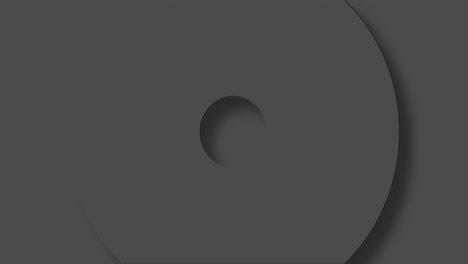 Animation-of-grey-circles-and-crosses-spinning-on-grey-background