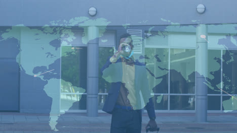 Animation-of-world-map-and-connections-with-man-in-face-mask-drinking-coffee-walking-in-street