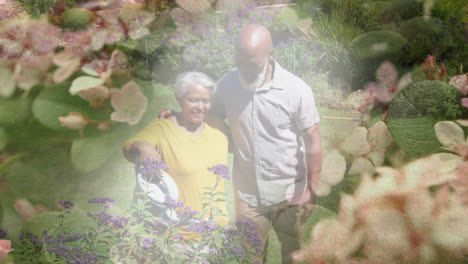 Animation-of-glowing-light-over-happy-senior-couple-gardening