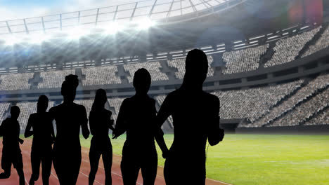 Animation-of-silhouettes-of-female-athletes-over-sports-stadium