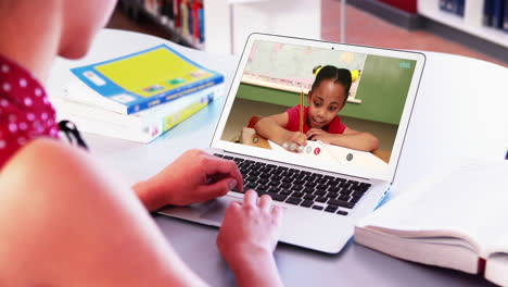 Caucasian-female-teacher-using-laptop-on-video-call-with-schoolgirl