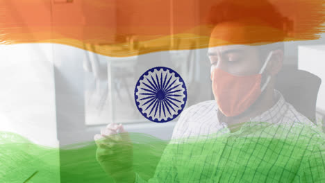 Composition-of-man-wearing-face-mask-over-indian-flag