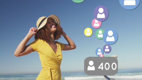 Animation-of-social-media-people-digital-icons-over-smiling-woman-on-beach