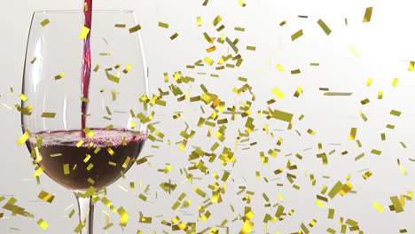 Animation-of-confetti-falling-over-glass-of-wine-on-white-background