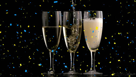 Animation-of-confetti-falling-over-champagne-glasses-on-black-background