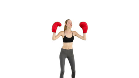 Fit-model-cheering-with-red-boxing-gloves