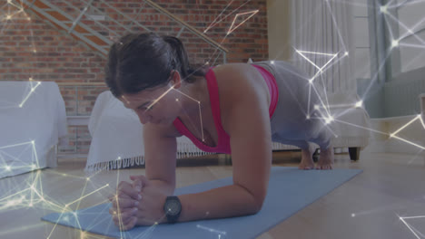 Glowing-network-of-connections-against-caucasian-woman-performing-plank-exercise-at-home